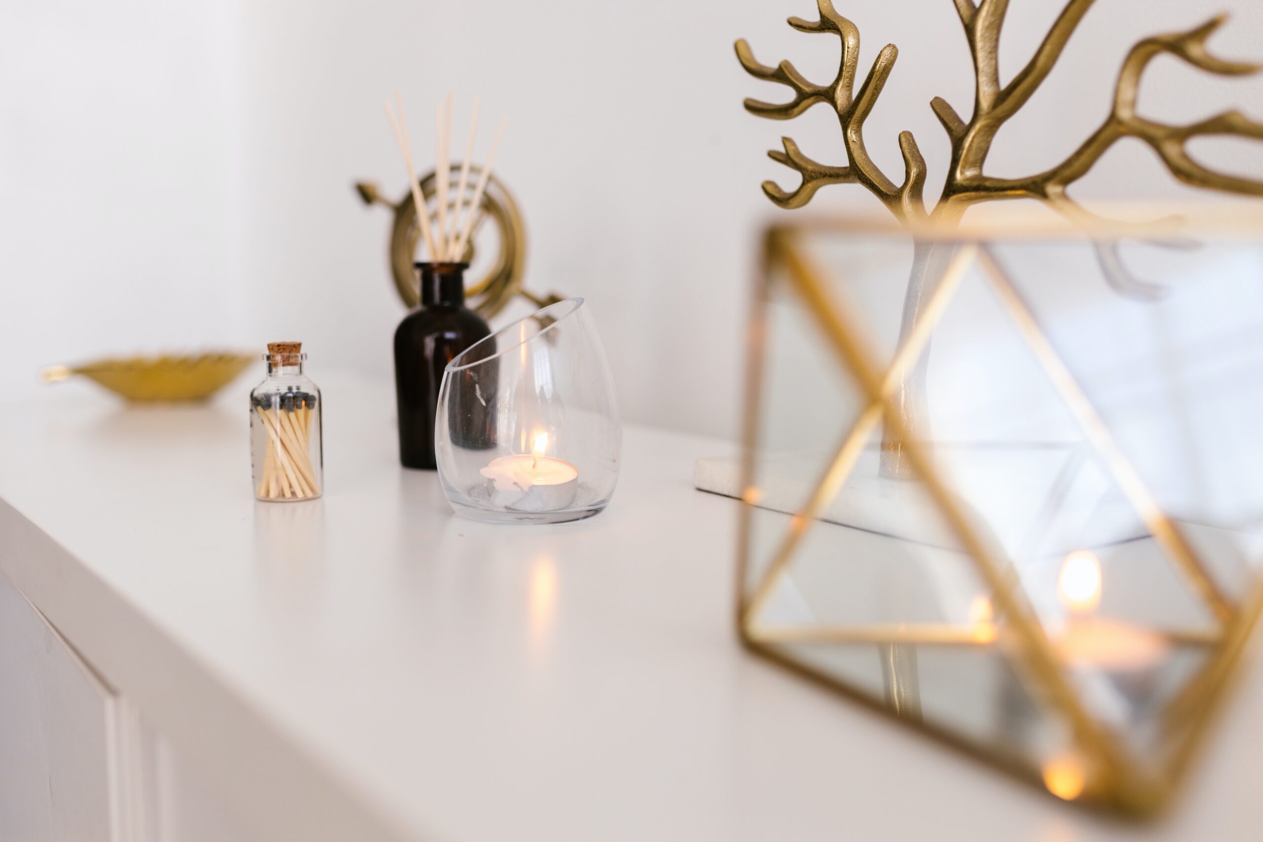 Decorative items on a shelf in neutral colours